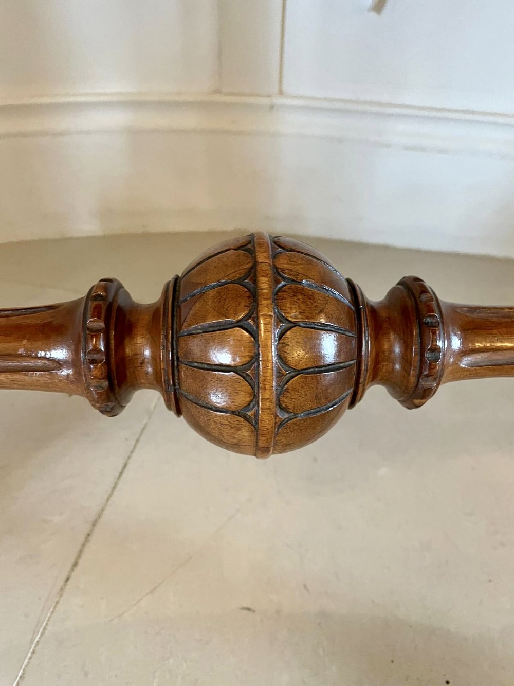 A Victorian burr walnut kidney-shaped writing table with floral marquetry inlay, green leather panels, and a central raised writing slope. View XV