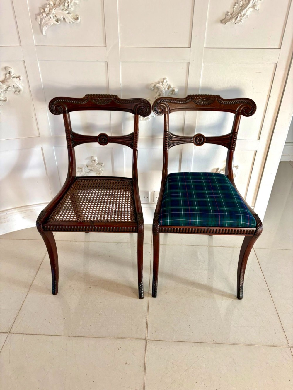 A set of six Regency mahogany dining chairs featuring carved bar-back crest rails, rosettes, and green tartan fabric upholstery. View IV