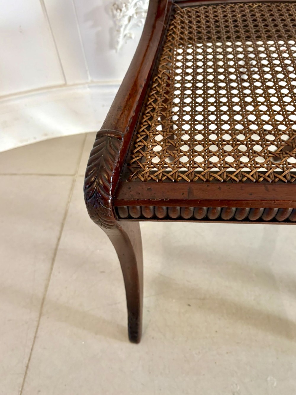 A set of six Regency mahogany dining chairs featuring carved bar-back crest rails, rosettes, and green tartan fabric upholstery. View VII