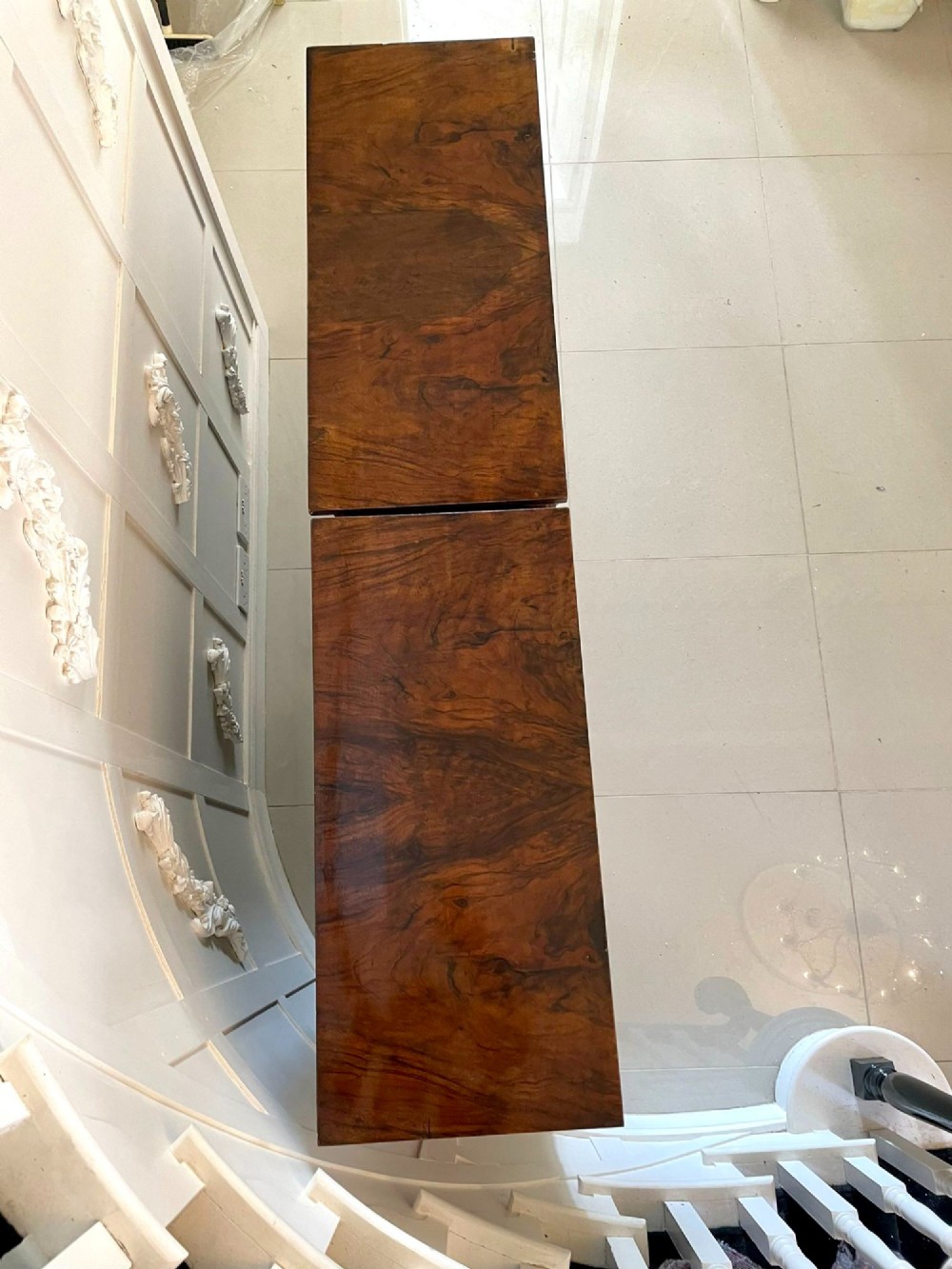 A pair of Victorian burr walnut pier cabinets featuring inlaid wood borders, gilt-bronze mounts, and central oval painted porcelain plaques. View X