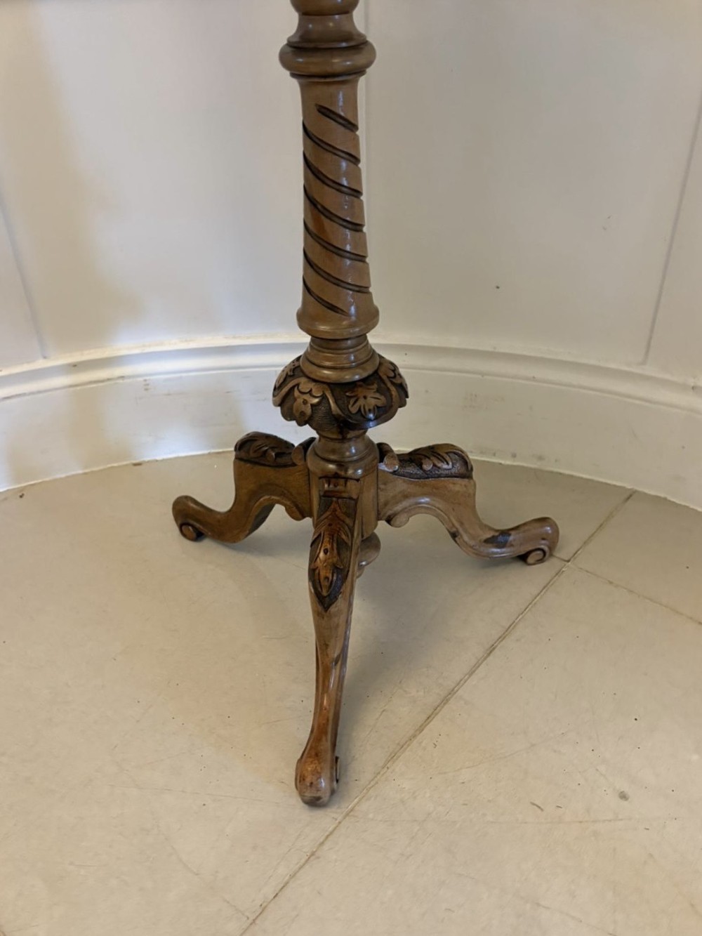 An antique Victorian burr walnut side table featuring a shaped scalloped top, a spiral carved pedestal column, and three carved cabriole legs. View VIII