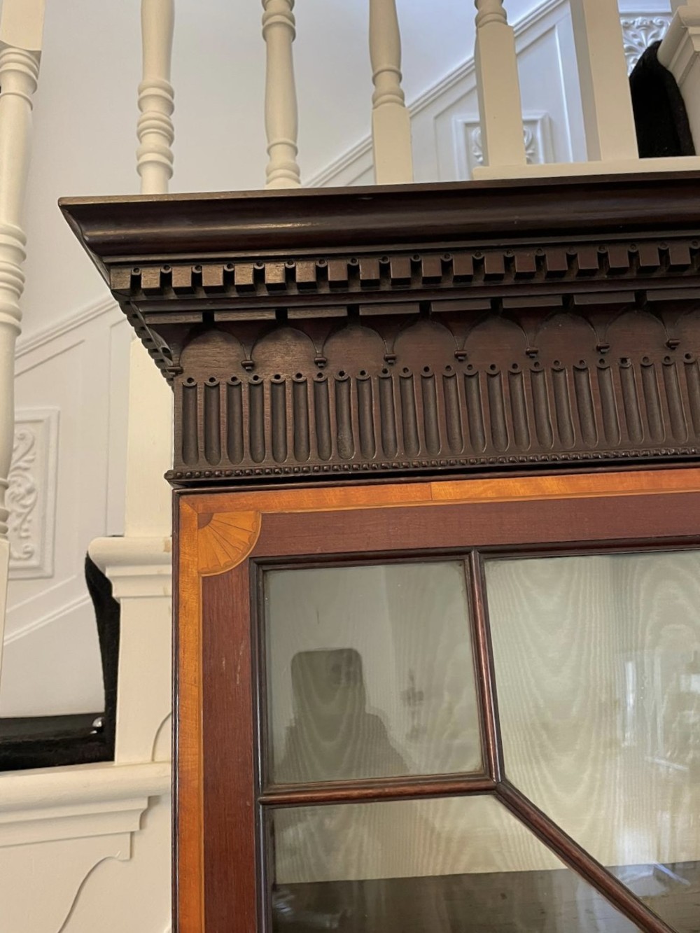 An 18th-century George III mahogany bureau bookcase featuring an upper astragal glazed cabinet above a slanted writing desk with four inlaid drawers and brass handles. View XI