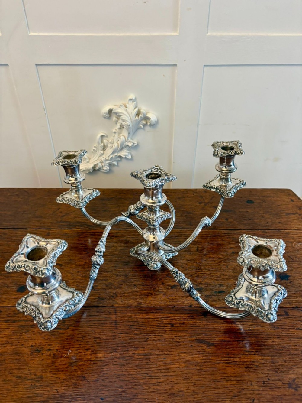 A Victorian silver-plated five-branch candelabra featuring scroll arms, ornate foliate moulding, and a shaped pedestal base. View II