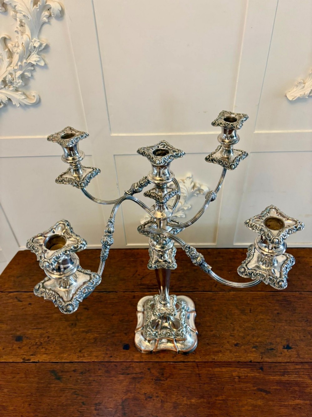 A Victorian silver-plated five-branch candelabra featuring scroll arms, ornate foliate moulding, and a shaped pedestal base. View VI