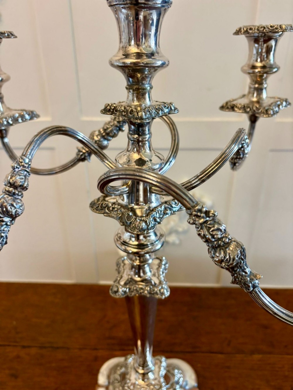 A Victorian silver-plated five-branch candelabra featuring scroll arms, ornate foliate moulding, and a shaped pedestal base. View VIII