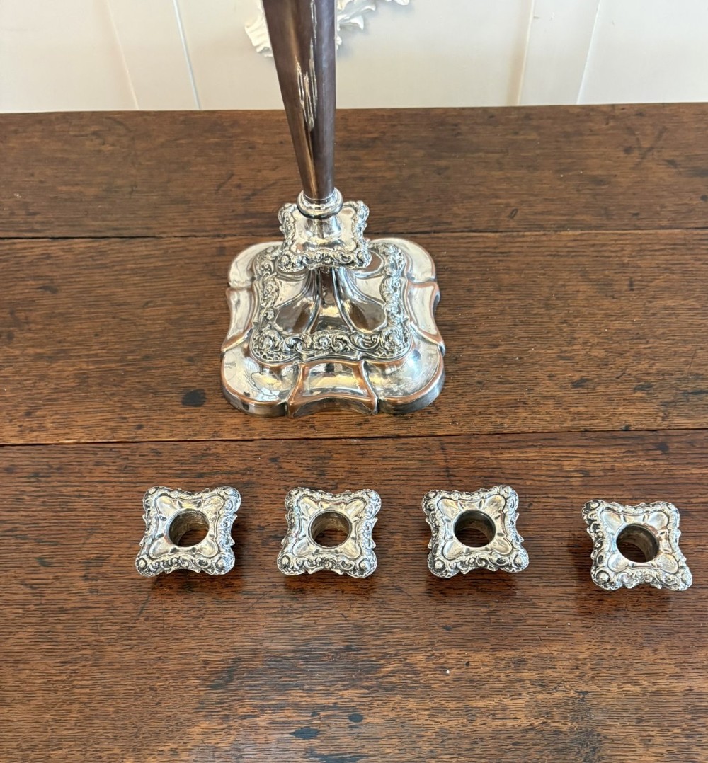 A Victorian silver-plated five-branch candelabra featuring scroll arms, ornate foliate moulding, and a shaped pedestal base. View IX