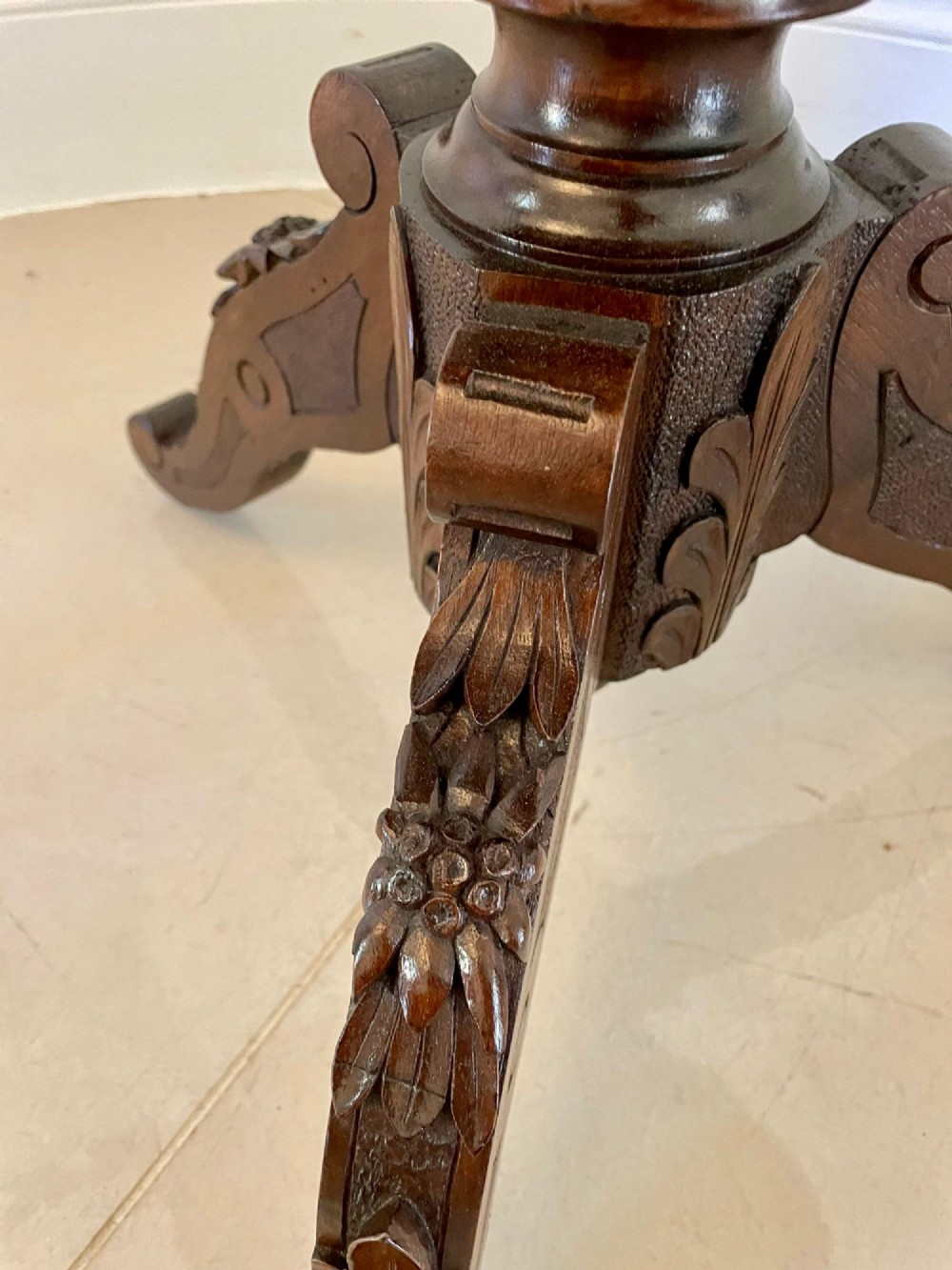 An antique walnut tilt-top side table featuring an oval top with elaborate marquetry depicting alpine wildlife and a carved tripod pedestal base. View VII