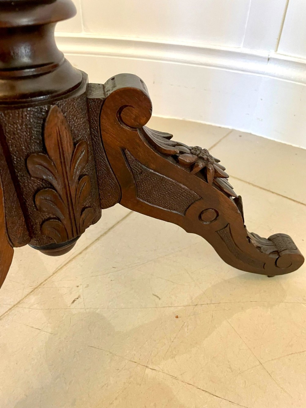An antique walnut tilt-top side table featuring an oval top with elaborate marquetry depicting alpine wildlife and a carved tripod pedestal base. View VIII