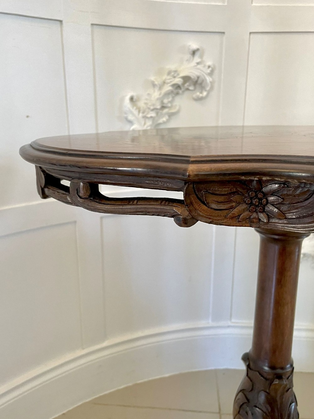 An antique walnut tilt-top side table featuring an oval top with elaborate marquetry depicting alpine wildlife and a carved tripod pedestal base. View IX