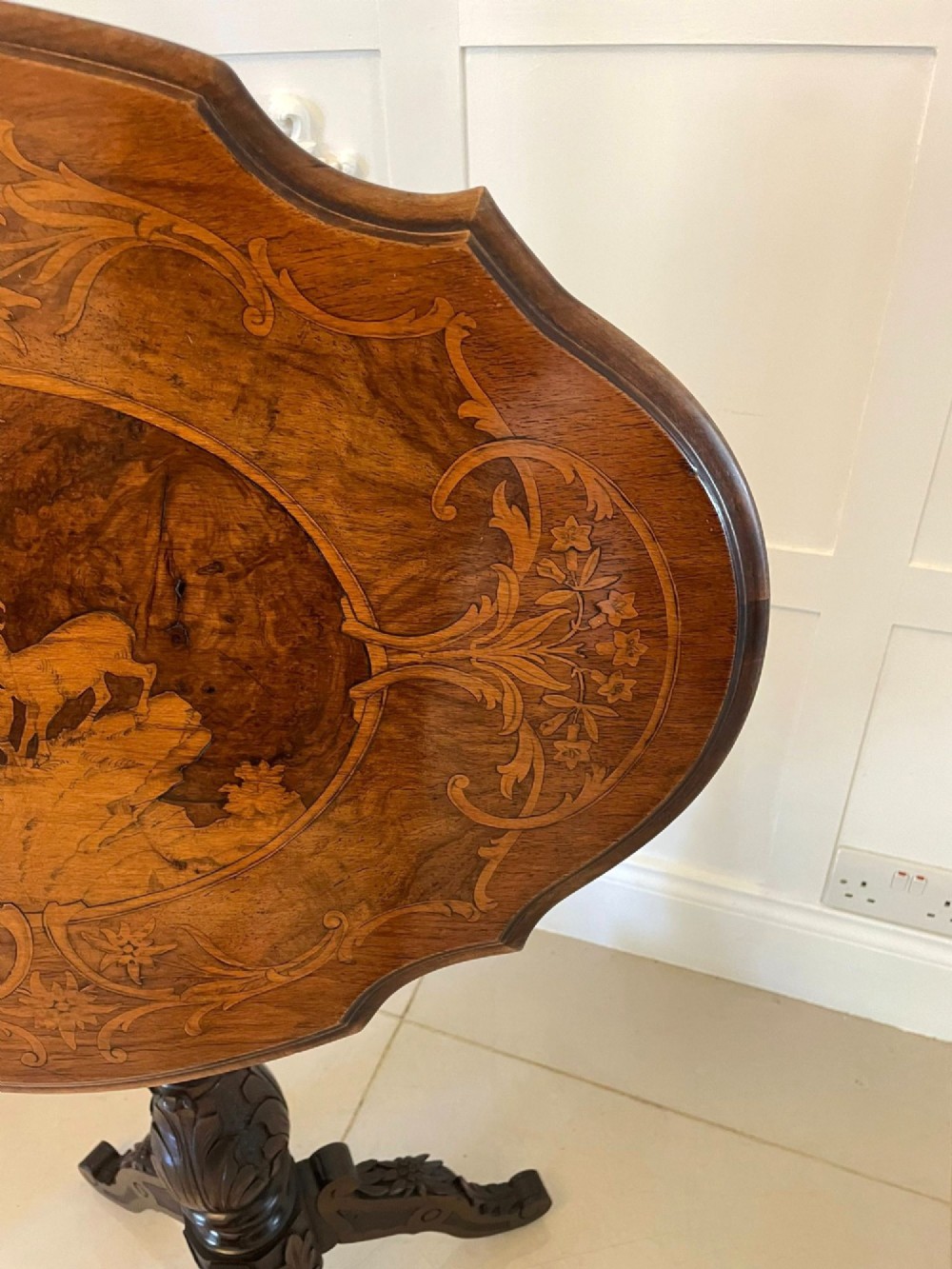 An antique walnut tilt-top side table featuring an oval top with elaborate marquetry depicting alpine wildlife and a carved tripod pedestal base. View XIII