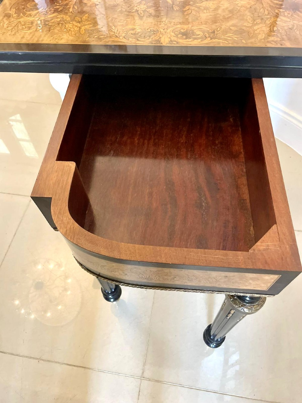 An antique French ebonised and walnut marquetry fold-over card table with gilt bronze mounts and fluted legs. View VI