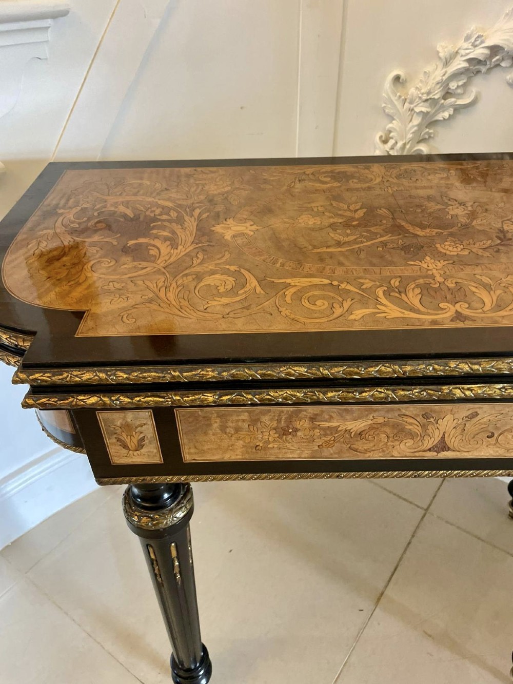An antique French ebonised and walnut marquetry fold-over card table with gilt bronze mounts and fluted legs. View VIII