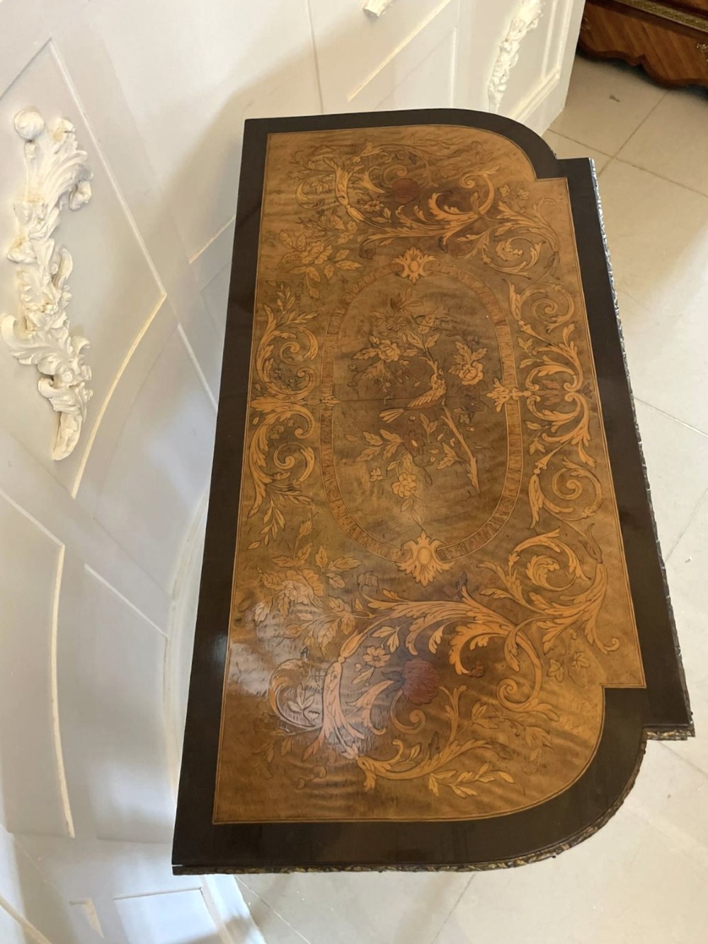 An antique French ebonised and walnut marquetry fold-over card table with gilt bronze mounts and fluted legs. View IX