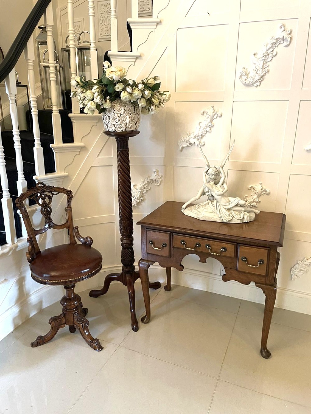 An 18th-century George III oak lowboy featuring three drawers with brass swan-neck handles, a shaped apron, and cabriole legs ending in pad feet. View III