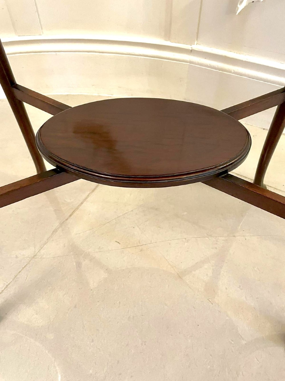 An oval mahogany lamp table featuring Art Nouveau central marquetry inlay, slender curved legs, and a lower oval shelf. View VI