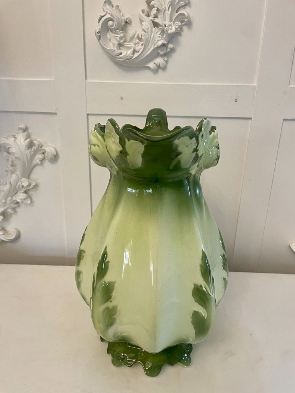 An Art Nouveau green and cream glazed ceramic jug with moulded relief leaf details resting inside a matching wash basin. View VII