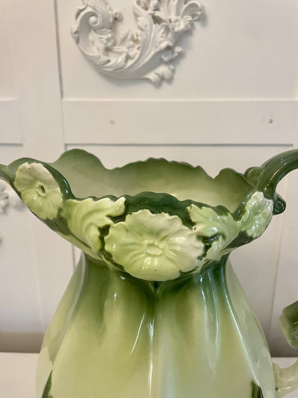 An Art Nouveau green and cream glazed ceramic jug with moulded relief leaf details resting inside a matching wash basin. View IX