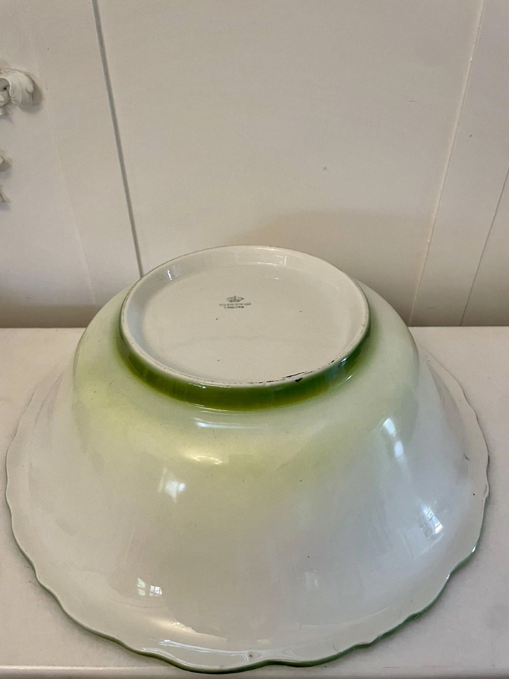 An Art Nouveau green and cream glazed ceramic jug with moulded relief leaf details resting inside a matching wash basin. View XI