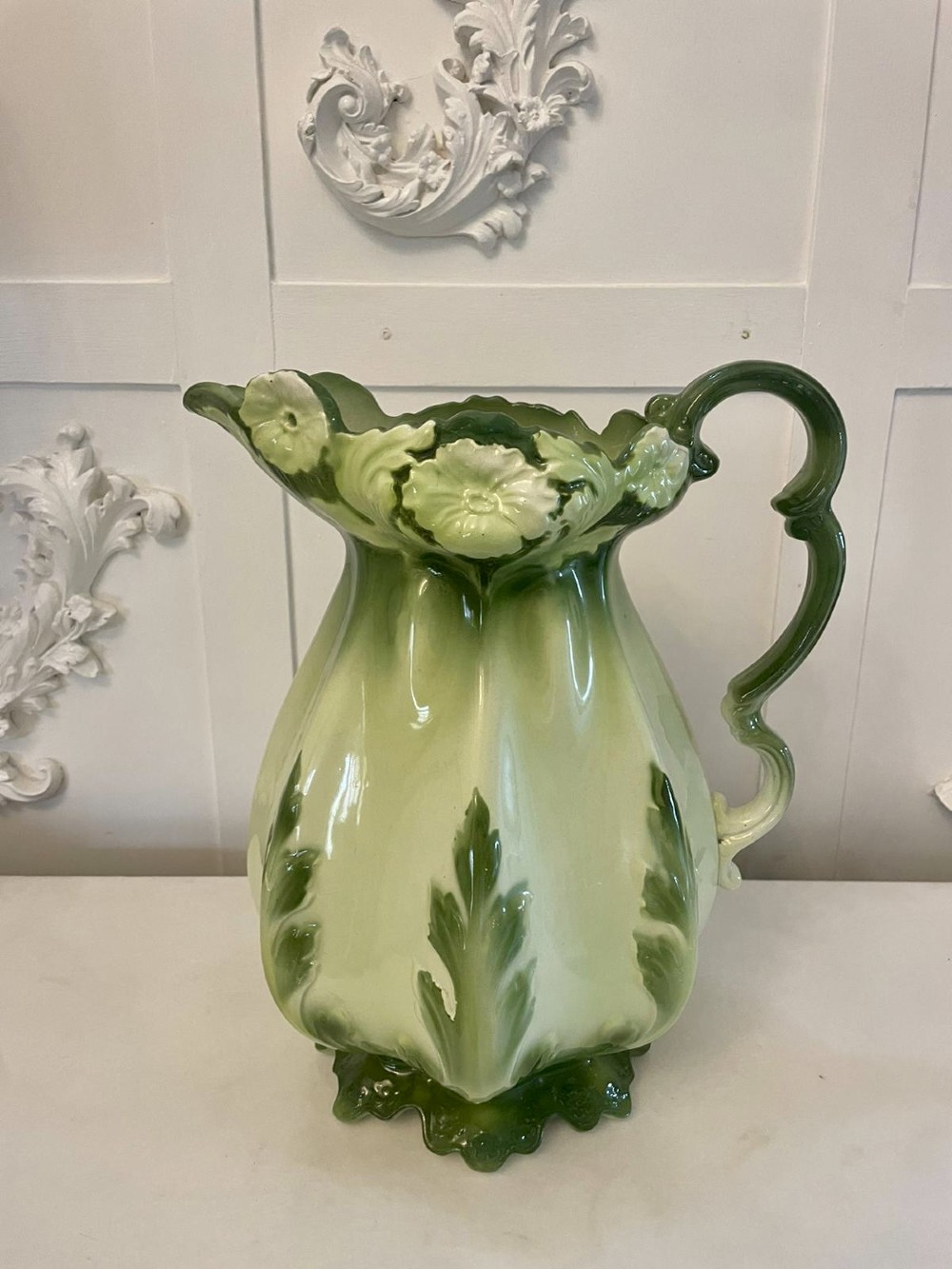 An Art Nouveau green and cream glazed ceramic jug with moulded relief leaf details resting inside a matching wash basin. View XII