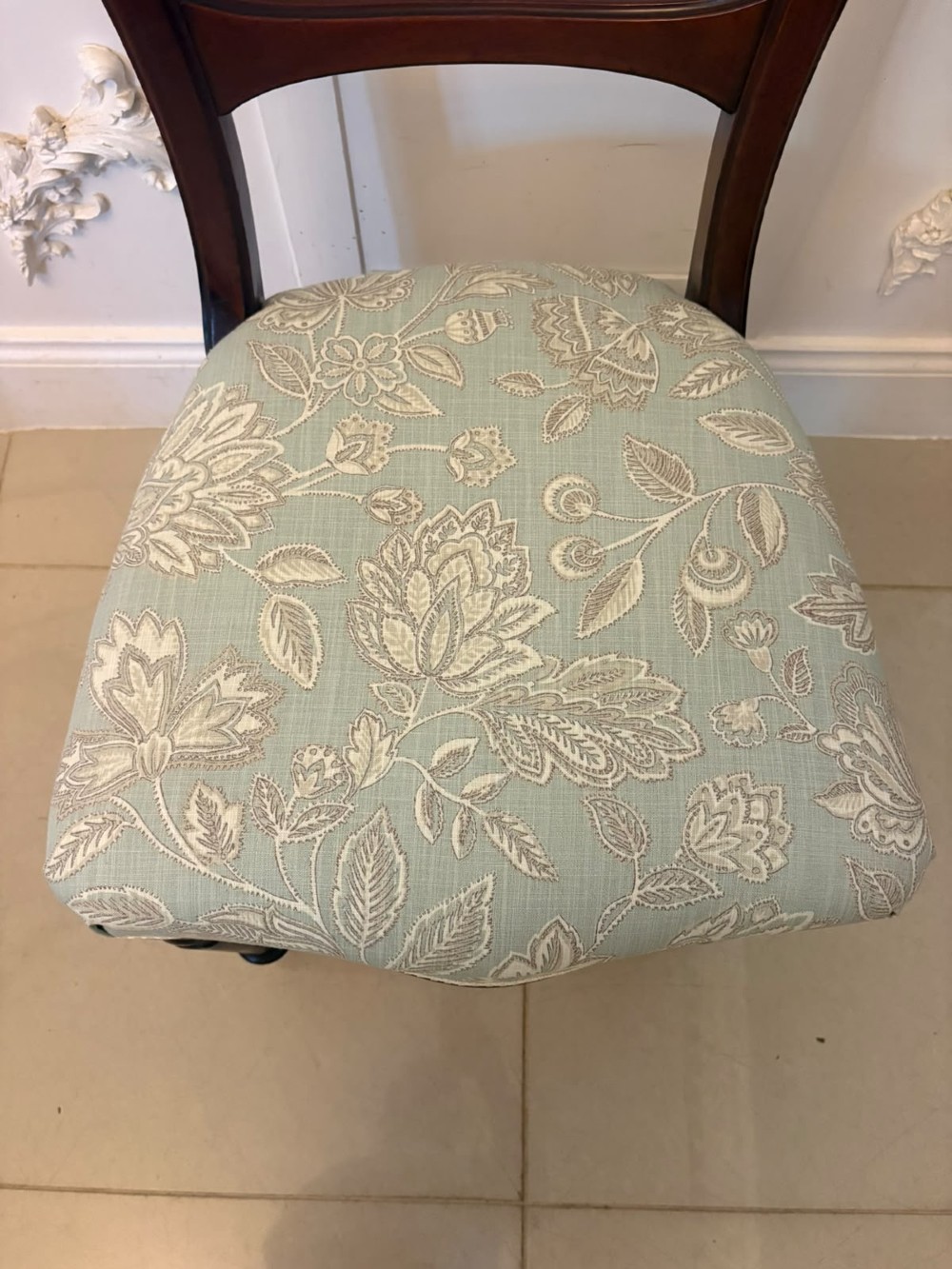 Set of six Victorian mahogany dining chairs featuring curved open backrests, reeded front legs, and light blue pattern-upholstered seats. View VI