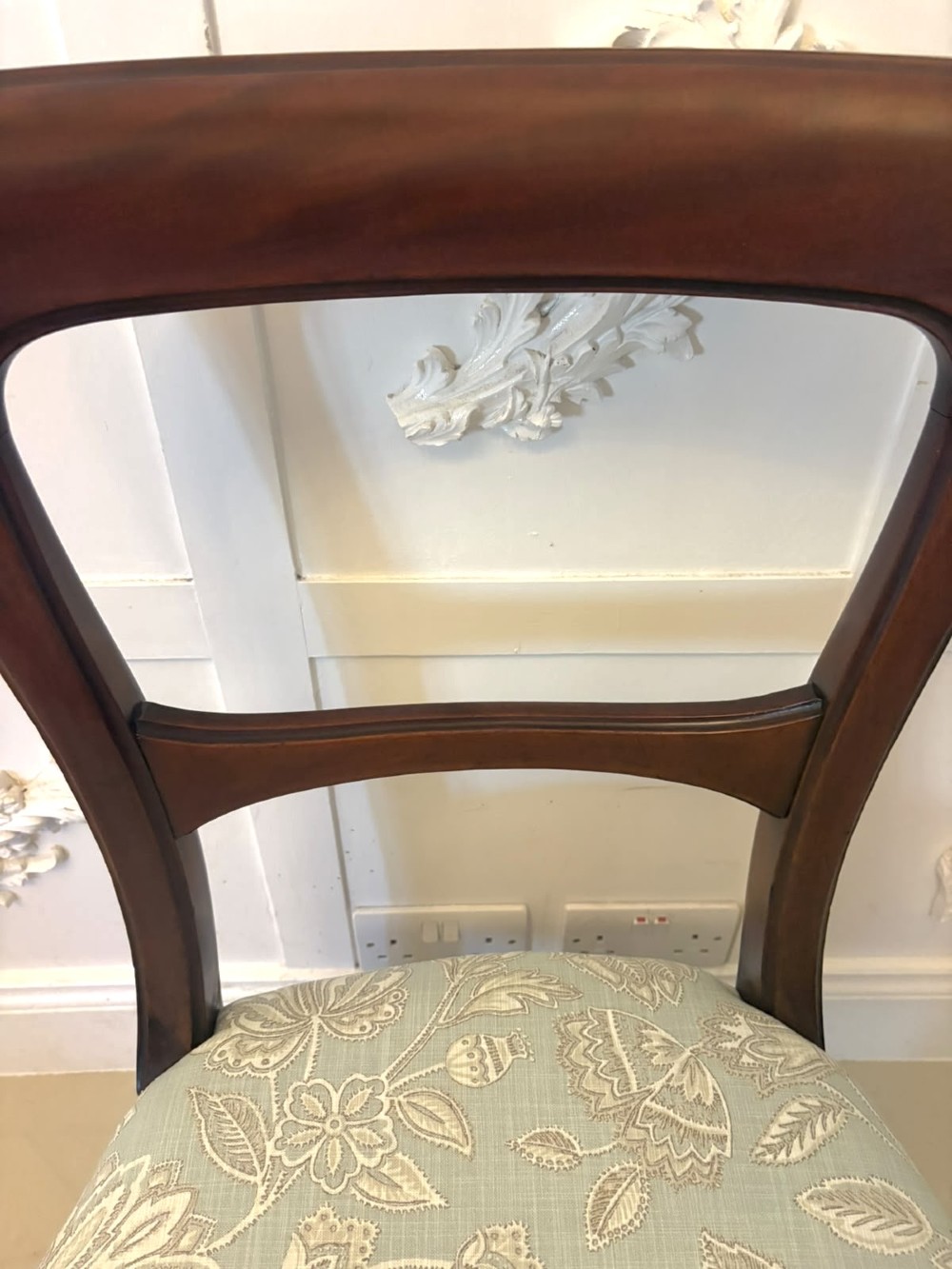 Set of six Victorian mahogany dining chairs featuring curved open backrests, reeded front legs, and light blue pattern-upholstered seats. View VII