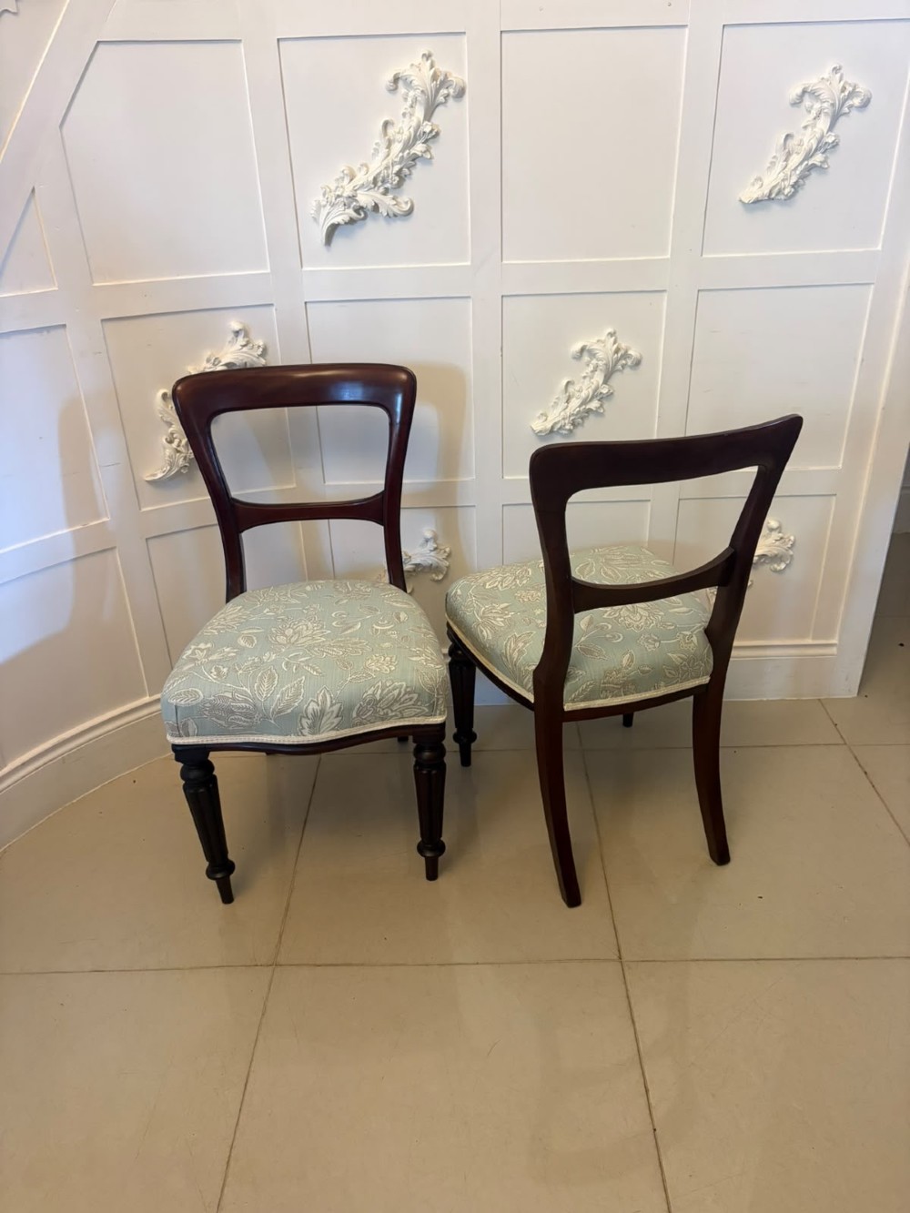 Set of six Victorian mahogany dining chairs featuring curved open backrests, reeded front legs, and light blue pattern-upholstered seats. View XII