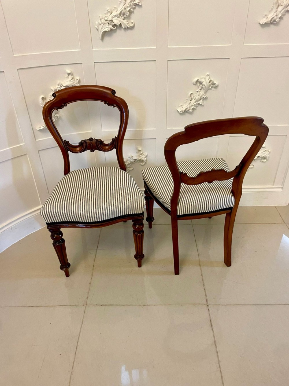 A set of six Victorian mahogany balloon back dining chairs with carved waist rails, turned front legs, and striped upholstered seats. View XII