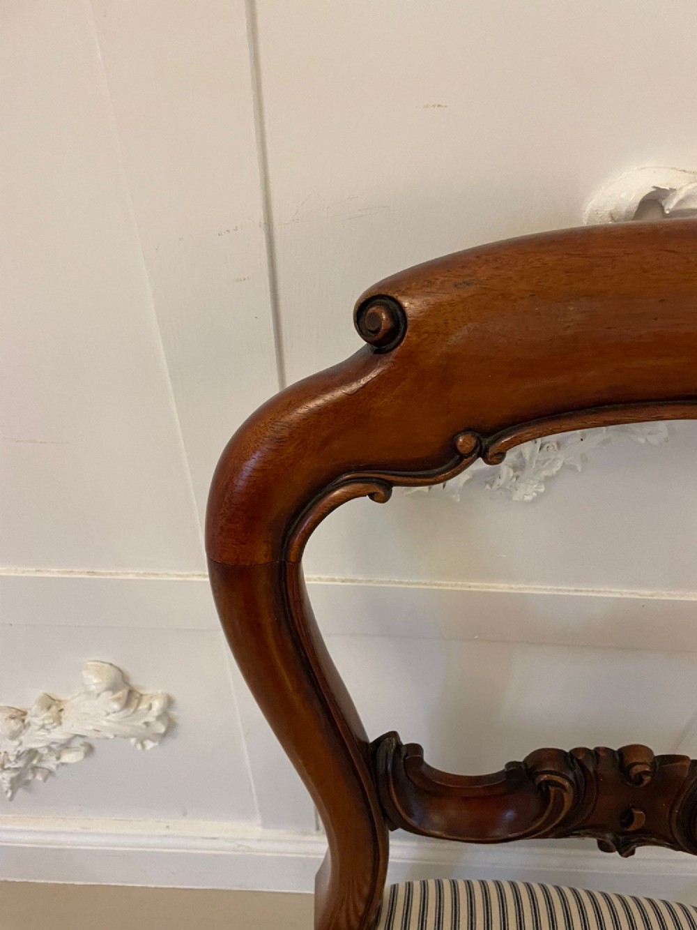 A set of six Victorian mahogany balloon back dining chairs with carved waist rails, turned front legs, and striped upholstered seats. View XIII