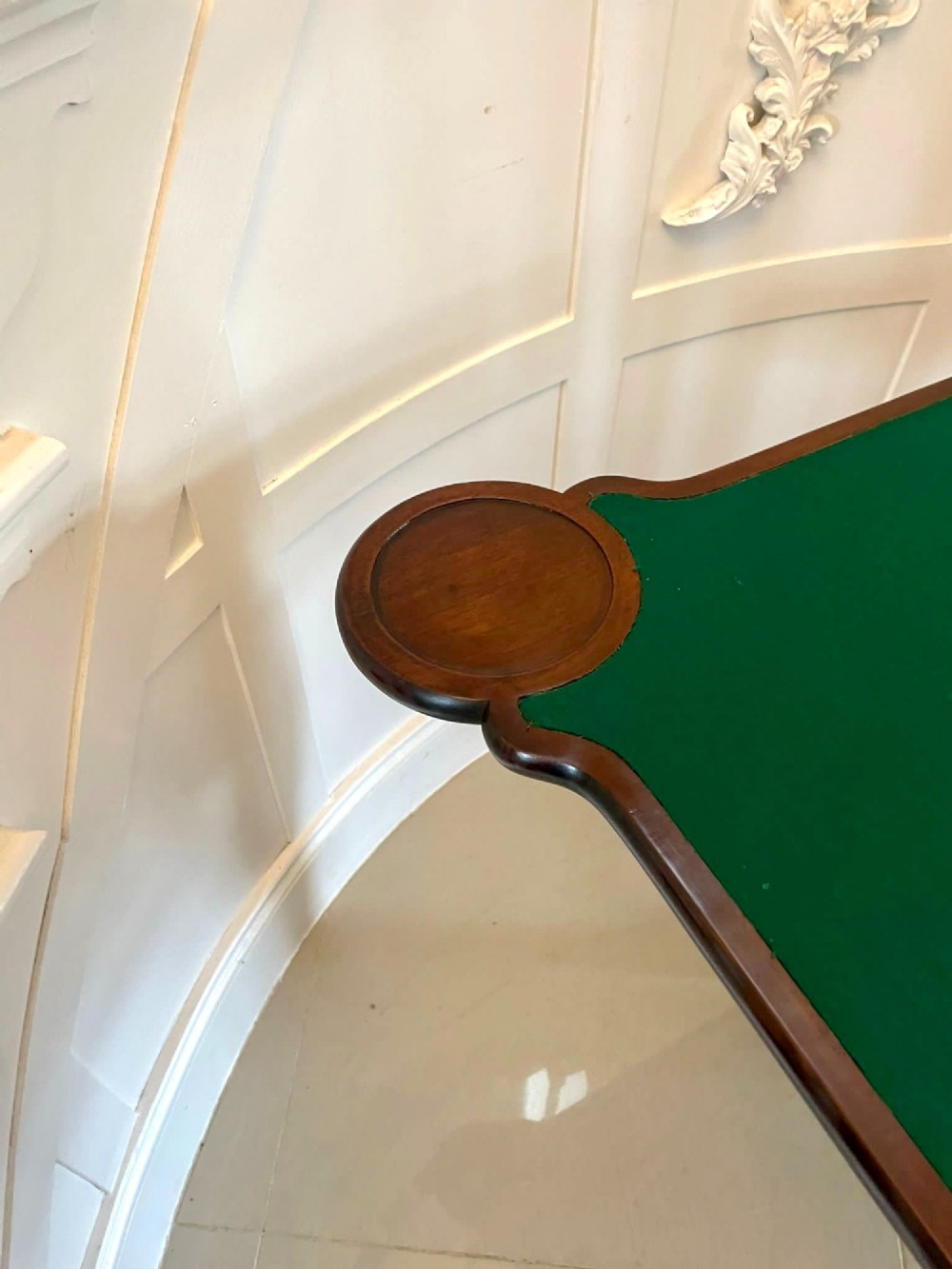 An 18th-century George II mahogany fold-over card table with carved cabriole legs, shell knees, and a central frieze drawer. View IV