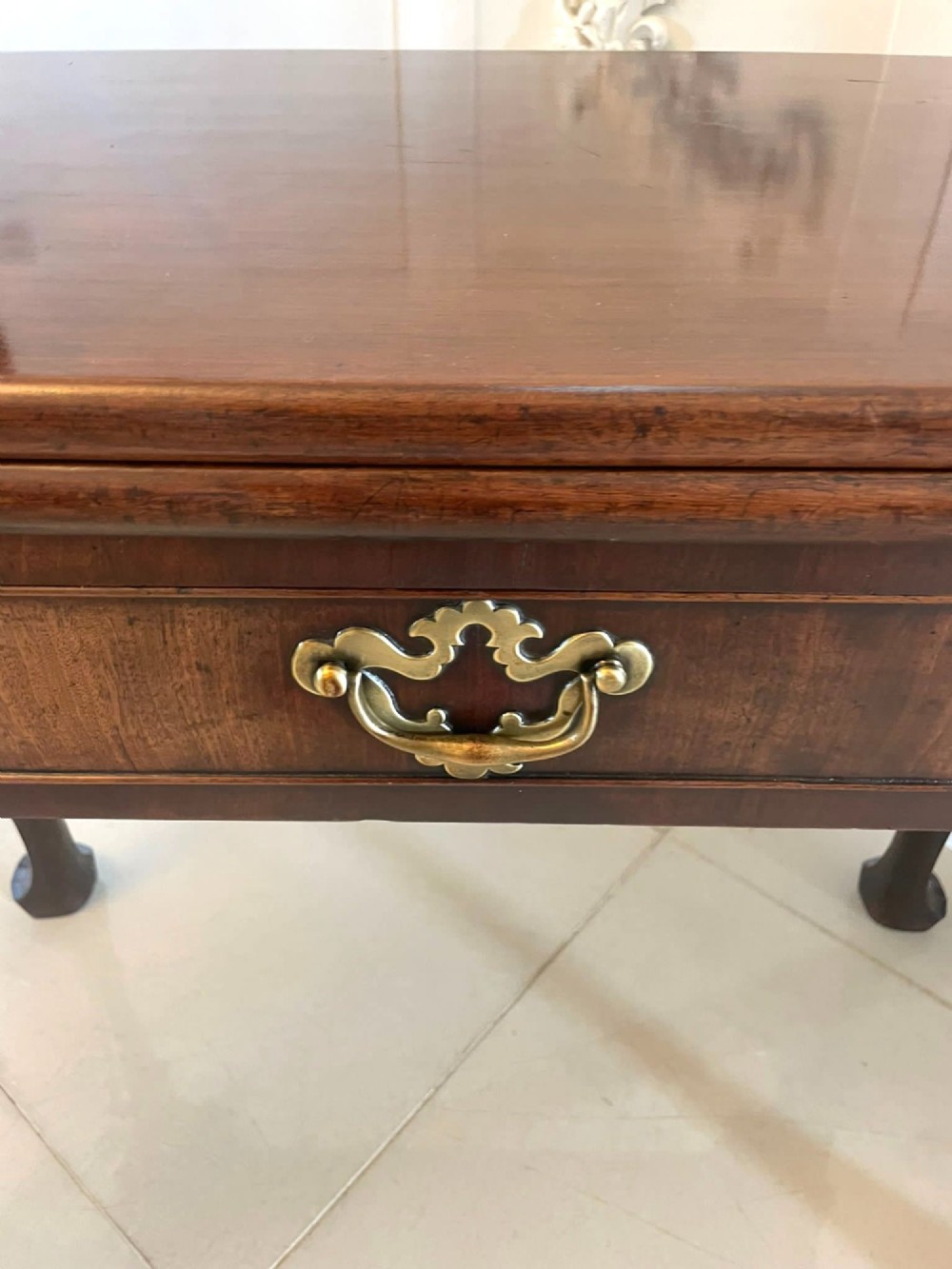 An 18th-century George II mahogany fold-over card table with carved cabriole legs, shell knees, and a central frieze drawer. View XII