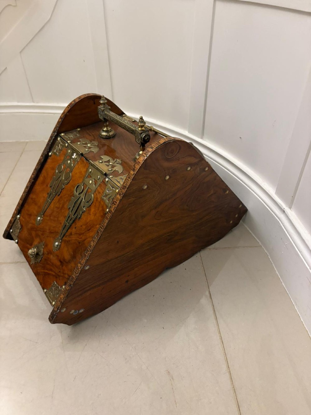 A Victorian walnut coal purdonium featuring ornate decorative brass strap hinges, brass corner plates, and a top carrying handle. View IV