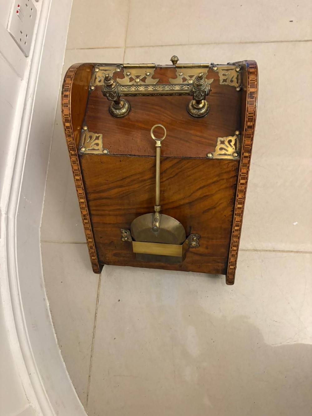 A Victorian walnut coal purdonium featuring ornate decorative brass strap hinges, brass corner plates, and a top carrying handle. View VIII