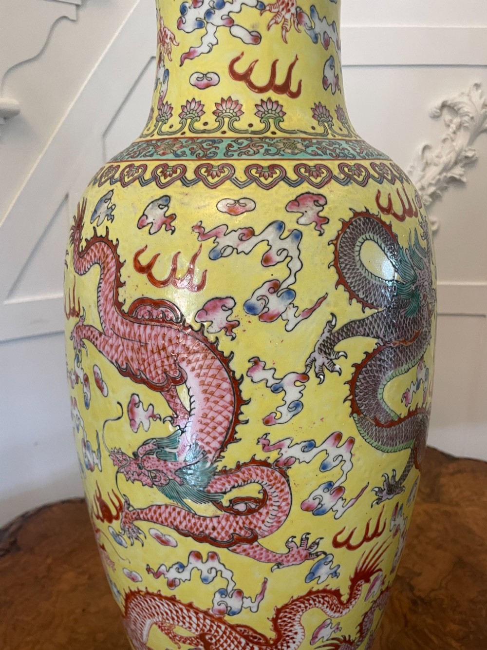 A pair of large 19th-century Chinese porcelain vase lamps featuring hand-painted dragons on a yellow ground, set on dark wooden bases. View XIII