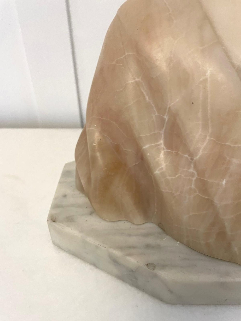 Carved Victorian alabaster bust depicting a young woman wearing a traditional bonnet, mounted on an octagonal marble base. View IX