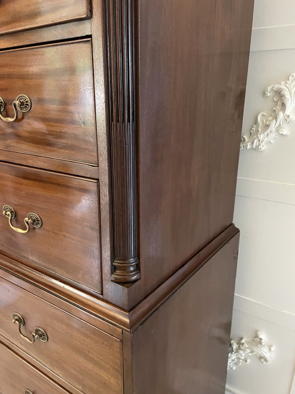 A tall George III mahogany chest on chest featuring two short over six long drawers with brass swan-neck handles and ogee bracket feet. View II