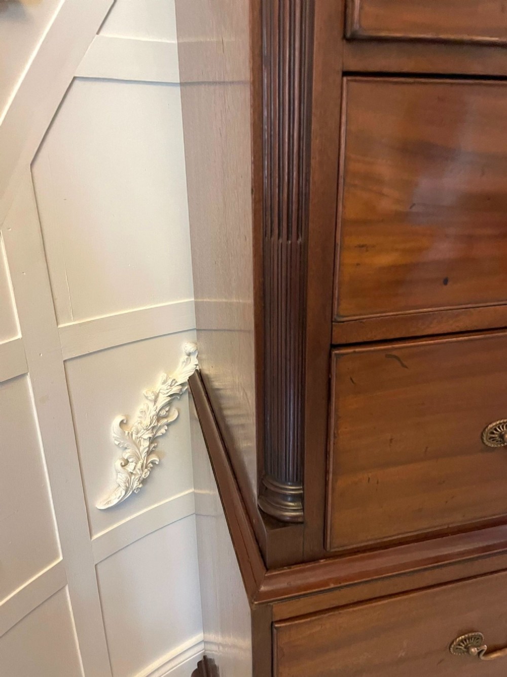 A tall George III mahogany chest on chest featuring two short over six long drawers with brass swan-neck handles and ogee bracket feet. View IV