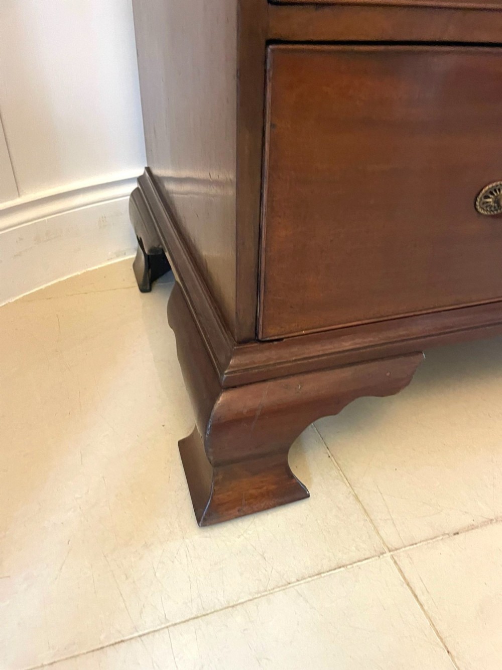 A tall George III mahogany chest on chest featuring two short over six long drawers with brass swan-neck handles and ogee bracket feet. View VI