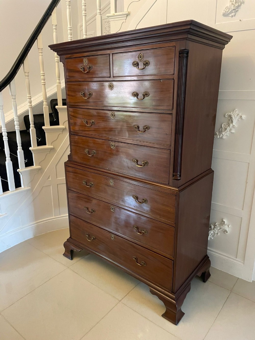 A tall George III mahogany chest on chest featuring two short over six long drawers with brass swan-neck handles and ogee bracket feet. View X
