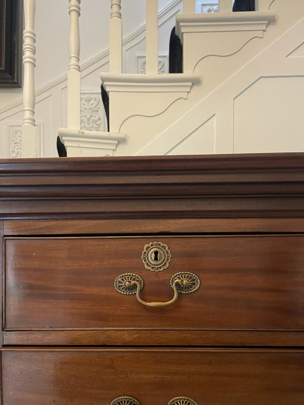 A tall George III mahogany chest on chest featuring two short over six long drawers with brass swan-neck handles and ogee bracket feet. View XI