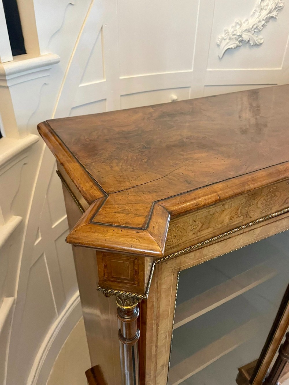 An antique Victorian burr walnut credenza featuring a central inlaid marquetry door flanked by two glazed display cabinets with brass mounts. View IX