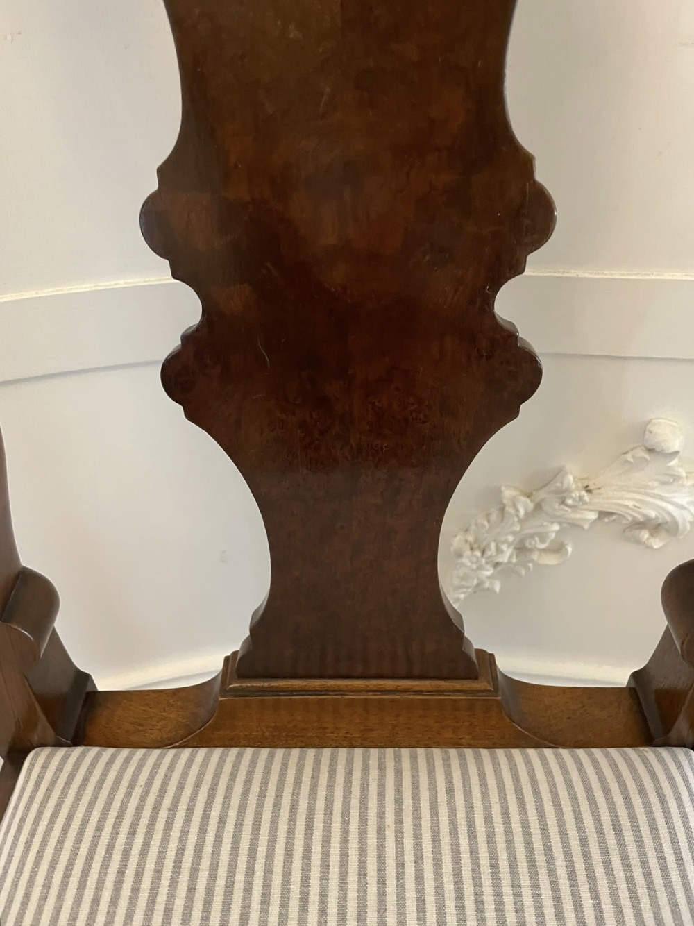 A set of ten walnut dining chairs featuring carved shell crests, splat backs, cabriole legs, and striped upholstered seats. View XIII
