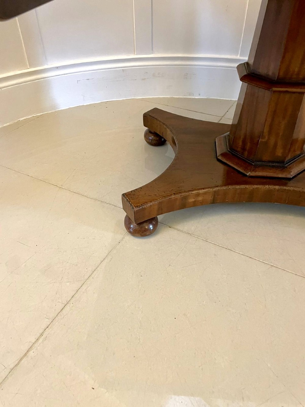 A Regency mahogany sofa table featuring two short drawers with black turned knobs, twin drop-leaf flaps, a central octagonal pedestal, and a quadruped base. View XIII