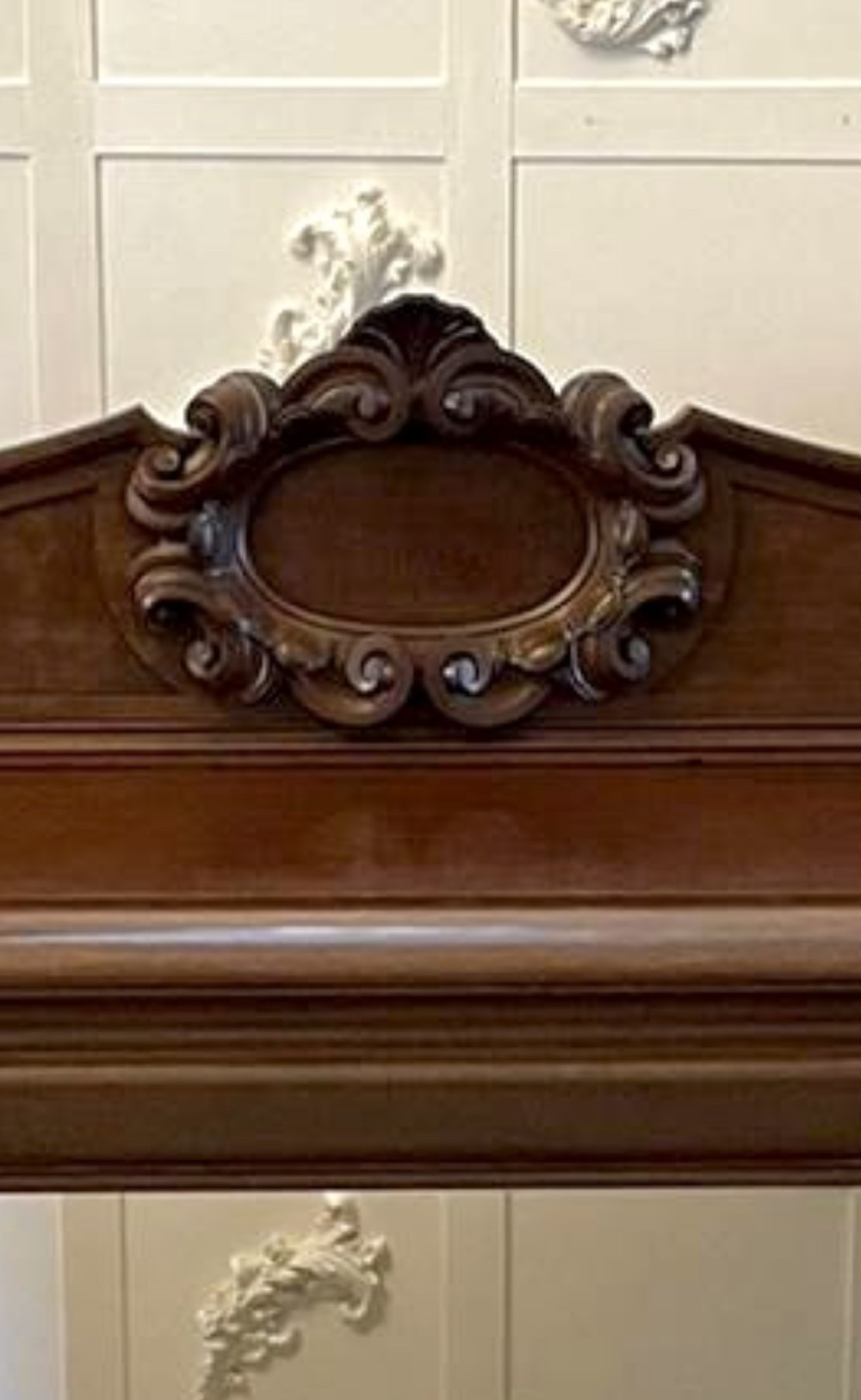A large William IV mahogany sideboard featuring an ornate carved splashback upstand and two pedestal cupboards with carved scrollwork. View III