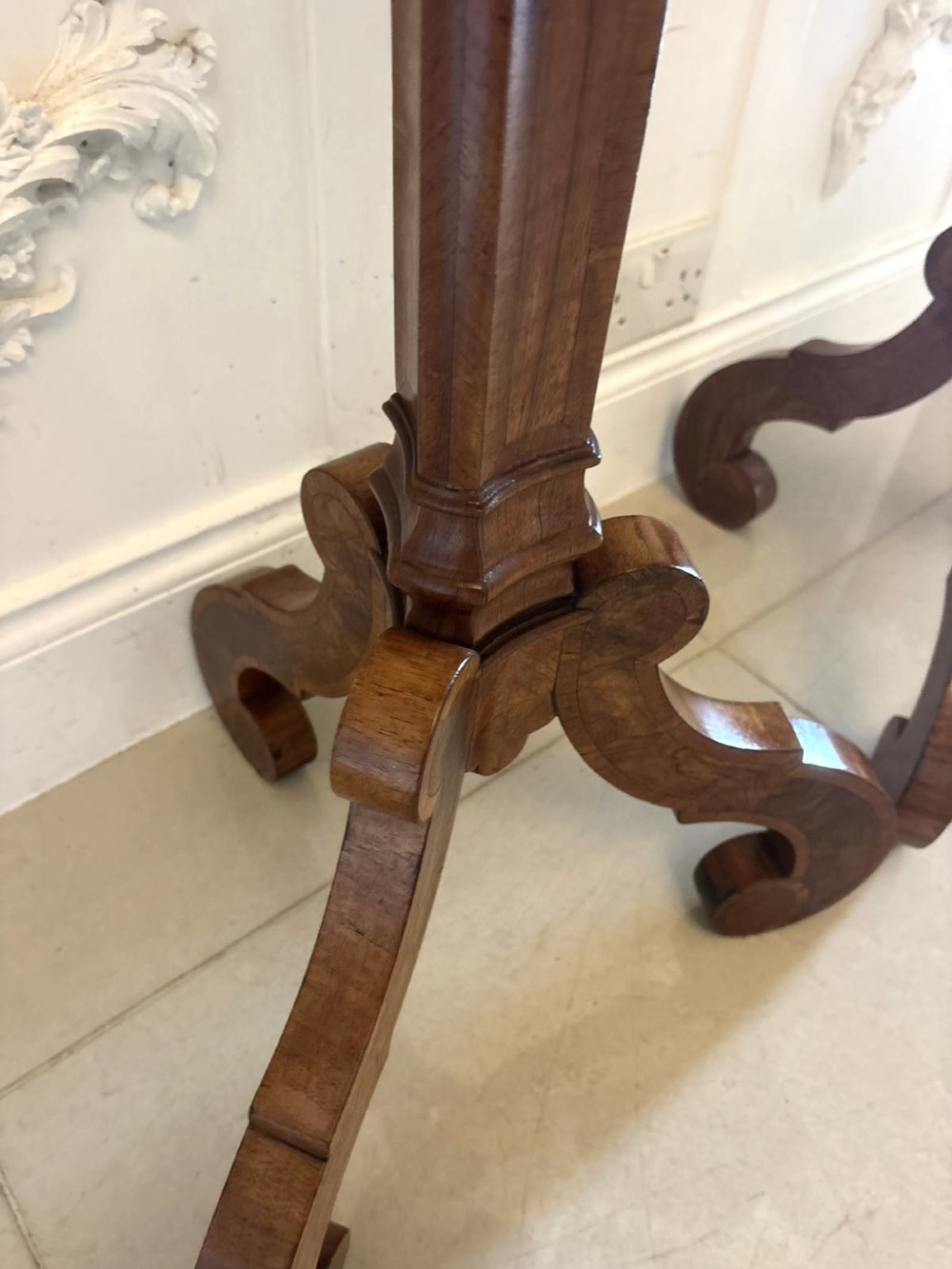 A pair of tall antique Dutch walnut and kingwood pedestal torcheres with molded hexagonal tops and scroll tripod feet. View VI