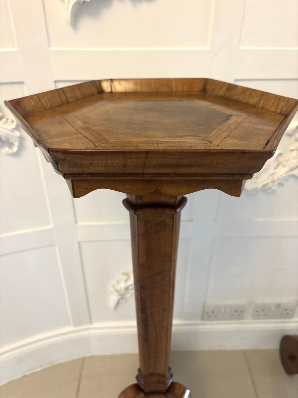 A pair of tall antique Dutch walnut and kingwood pedestal torcheres with molded hexagonal tops and scroll tripod feet. View VIII