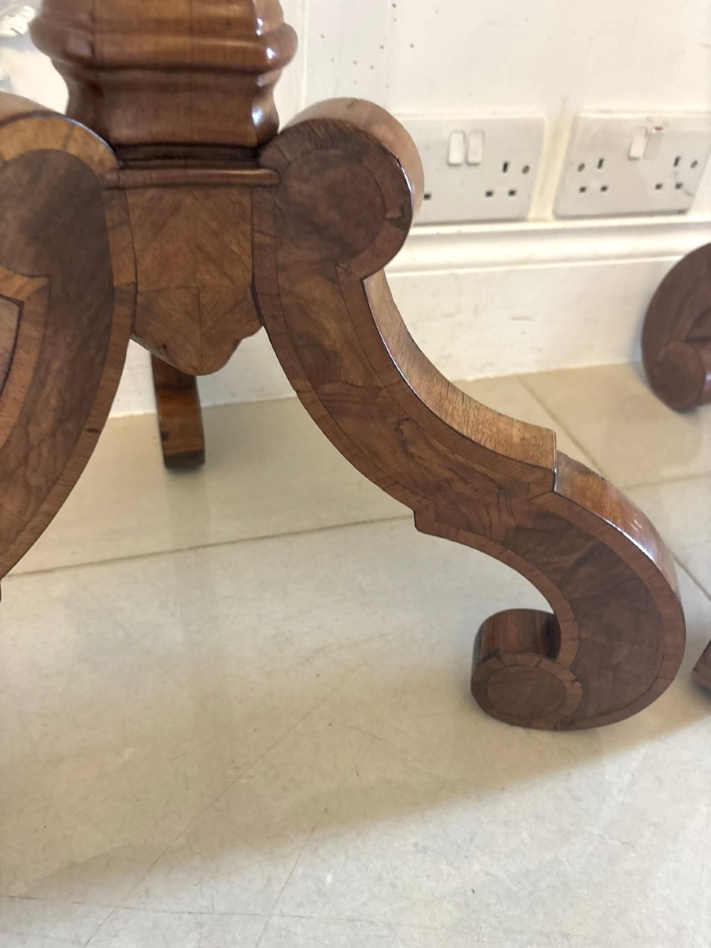 A pair of tall antique Dutch walnut and kingwood pedestal torcheres with molded hexagonal tops and scroll tripod feet. View IX
