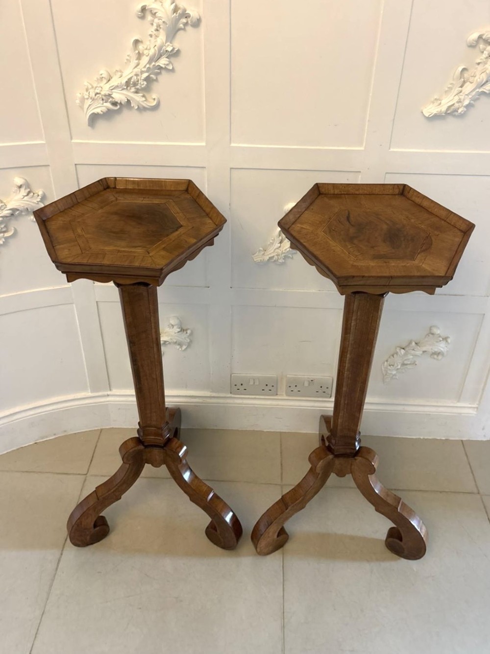 A pair of tall antique Dutch walnut and kingwood pedestal torcheres with molded hexagonal tops and scroll tripod feet. View XIV