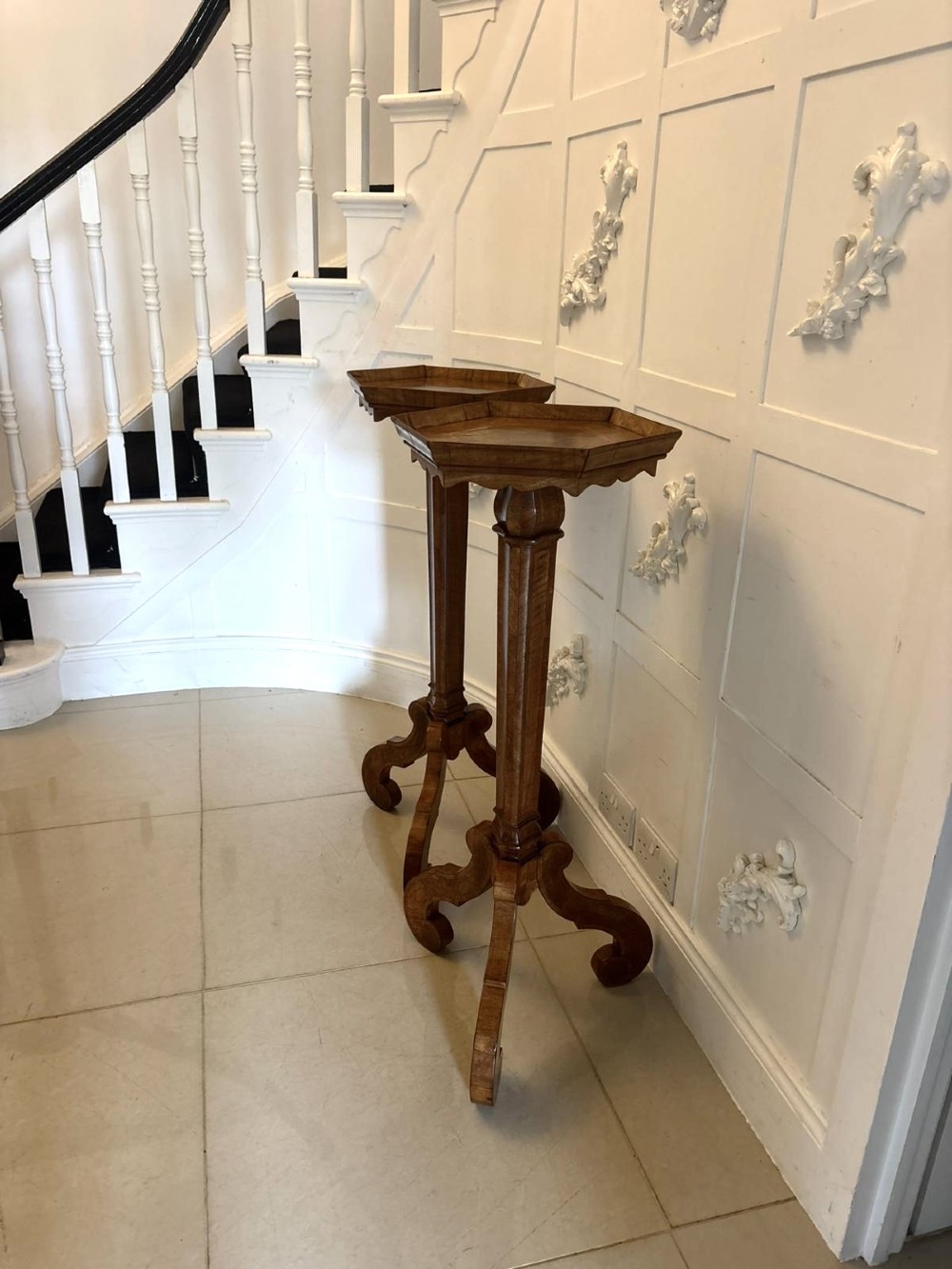 A pair of tall antique Dutch walnut and kingwood pedestal torcheres with molded hexagonal tops and scroll tripod feet. View XV