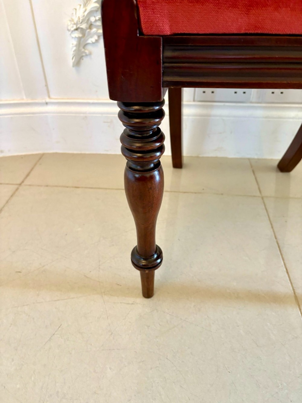 A set of eight Regency mahogany dining chairs featuring two carver armchairs and six side chairs with red upholstered seats. View IV