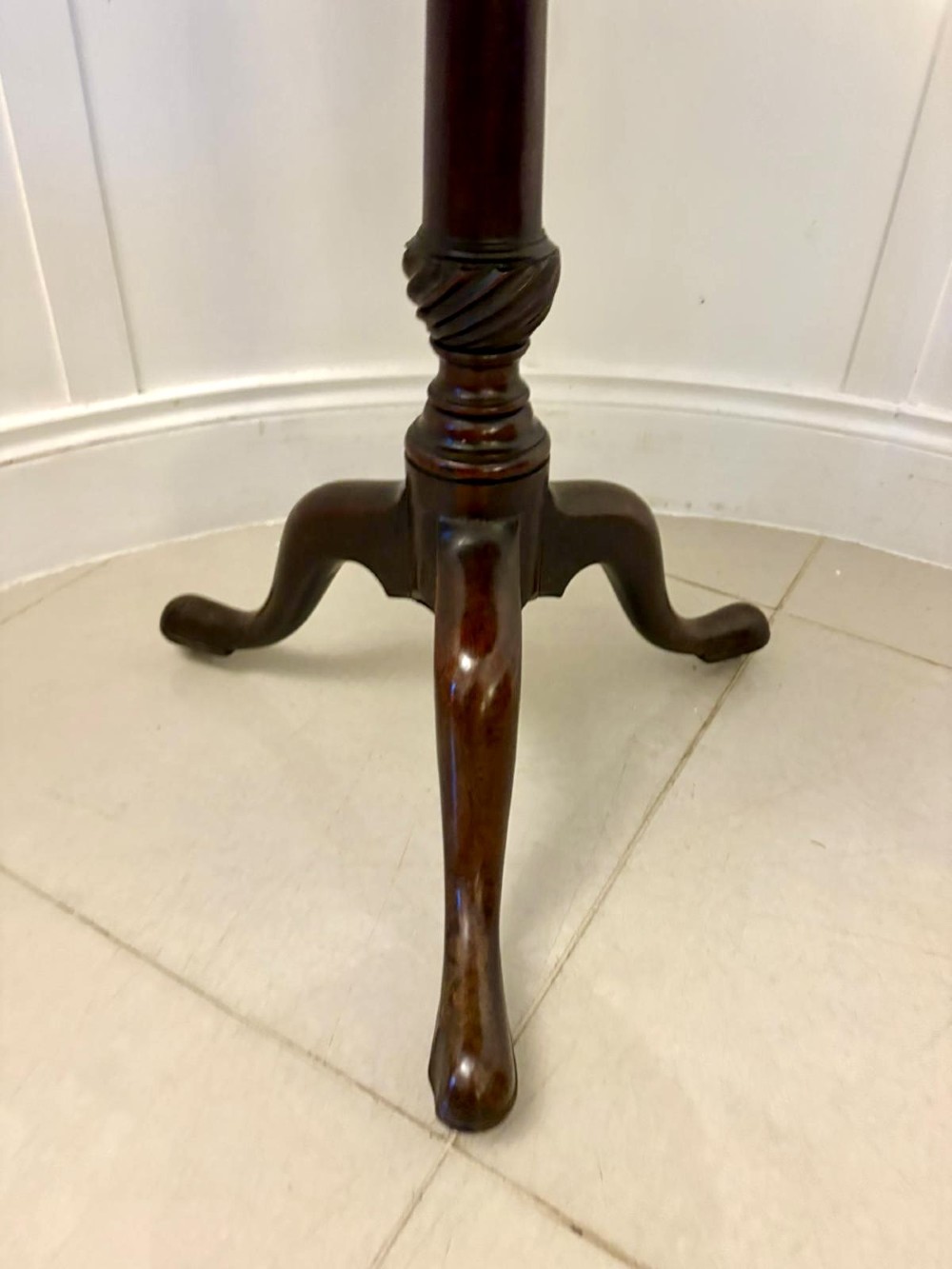 An 18th-century mahogany Chippendale tilt-top tripod table shown upright with a scalloped piecrust edge, turned column, and three cabriole legs. View VIII